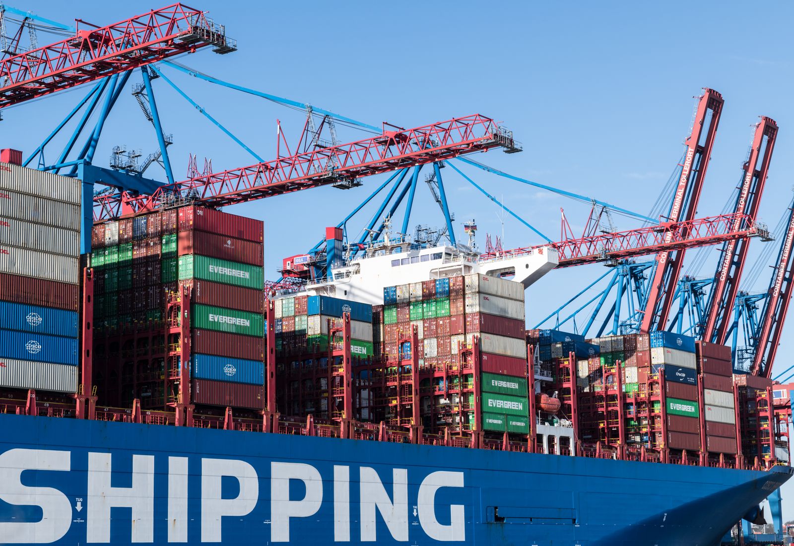 Shipping containers and gantry cranes at a working port